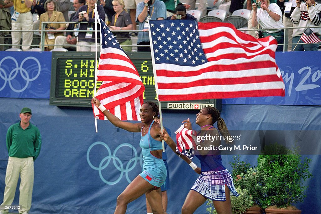 Venus and Serena Williams celebrate doubles win