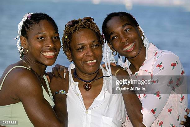 Serena, mother Oracene and Venus Williams of the USA pose for the media during the Lipton Championships on March 20, 1999 in Key Biscayne, Florida.