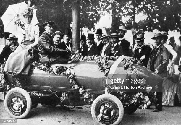 Laurels for Camille Jenatzy , the first man to exceed 100 kph at Acheres, near Paris. The car, christened 'Jamais Contente', was an electric vehicle...