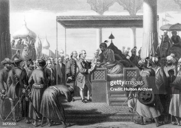 Robert Clive , British governor of India receives from Shah Alam, the Mughal Emperor of India, a decree conferring upon the East India Company the...