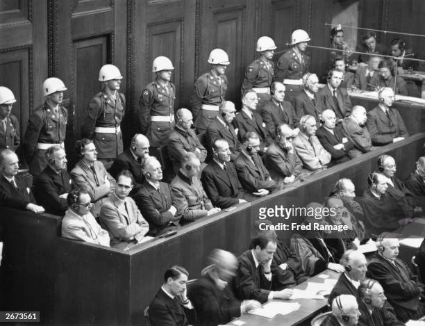 Leading Nazis in the dock in the courtroom at Nuremberg during the final stages of the war crimes trials. Front row, from left to right: Hermann...