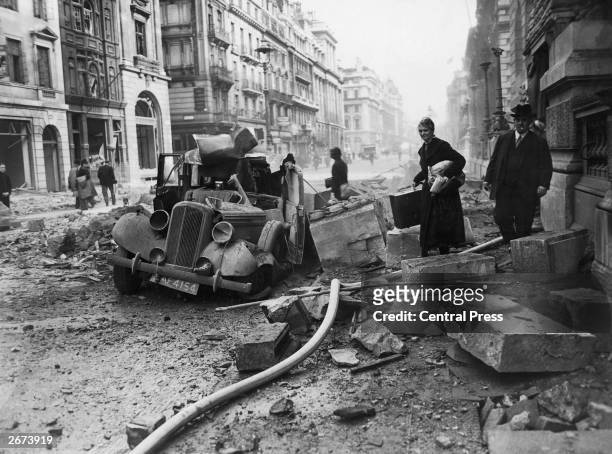 Wrecked Humber car on Pall Mall, London after an air raid during the London Blitz, 15th October 1940.