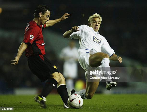 Alan Smith of Leeds clashes with Gary Neville of Man Utd during the Carling Cup, third round match between Leeds United and Manchester United at...