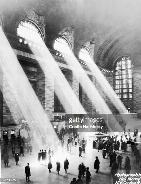 Beams of sunlight streaming through the windows at Grand Central Station, New York.