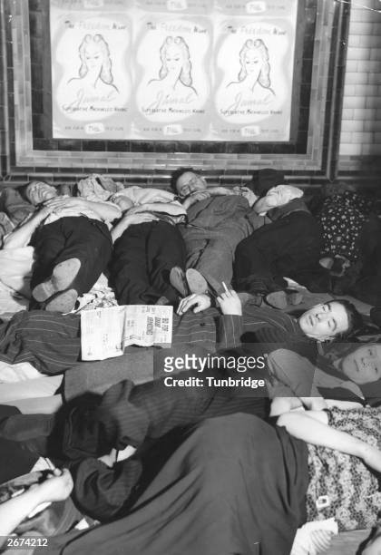 People sheltering in Piccadilly tube station, London, during an air raid in the Second World War.