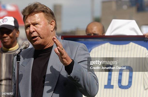 Former Chicago Cub third baseman Ron Santo speaks to the fans during a retirement ceremony for Santo's uniform number 10 before a game against the...