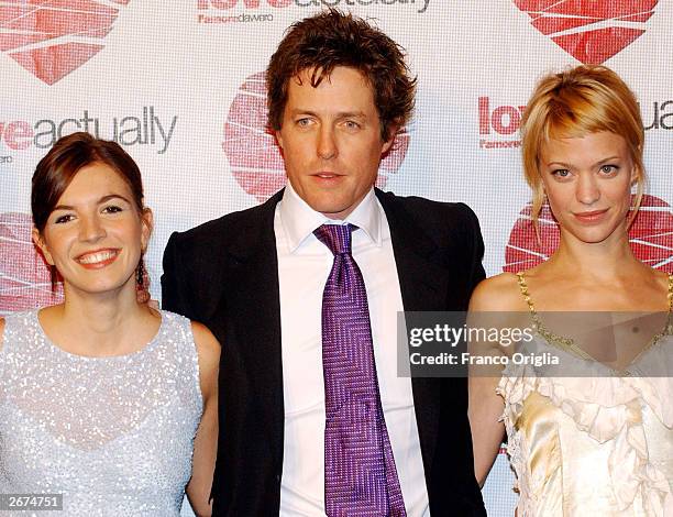 Actress Lucia Moniz, actor Hugh Grant and actress Heike Makatsch arrive at the premiere of his new movie "Love Actually" directed by Richard Curtis...