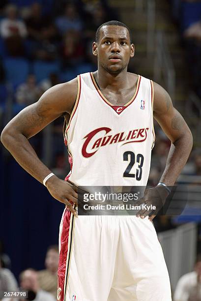 LeBron James of the Cleveland Cavaliers looks on during the preseason game against the Milwaukee Bucks on October13, 2003 at Gund Arena in Cleveland,...