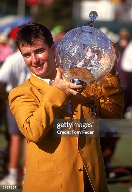 Craig Parry of Australia holds aloft the trophy after winning the Australian Masters Golf Tournament held at the Huntingdale Golf Club 1992, in...