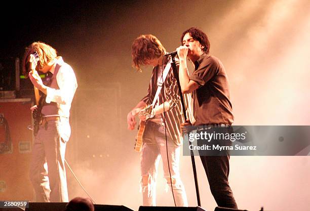 Nikolai Fraiture, Nick Valensi and Julian Casablancas of The Strokes perform at 'The Theatre' at Madison Square Garden on October 28, 2003 in New...