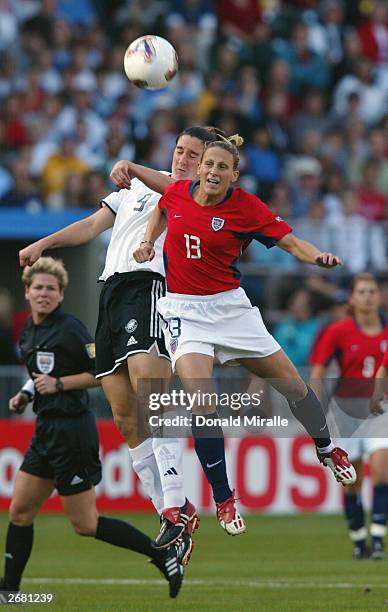 Kristine Lilly of the USA and Birgit Prinz of Germany jump for a header during the semifinals of the FIFA Women's World Cup match on October 5, 2003...