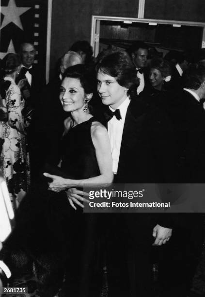 Belgian-born actor Audrey Hepburn and her son, Sean Ferrer, attend an AFI tribute to Fred Astaire, Los Angeles, California, April 18, 1981.