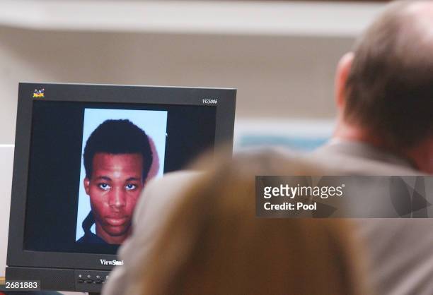 Photograph of sniper suspect Lee Boyd Malvo is displayed on a computer screen during the trial of Washington area sniper suspect John Allen Muhammad...