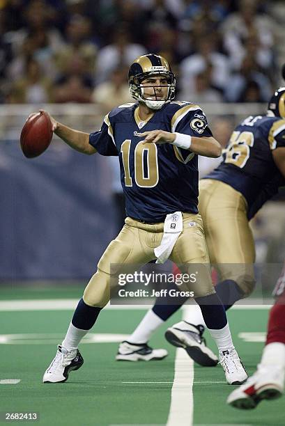 Quarterback Marc Bulger of the St. Louis Rams throws a pass against the Arizona Cardinals on September 28, 2003 at the Edward Jones Dome in St....