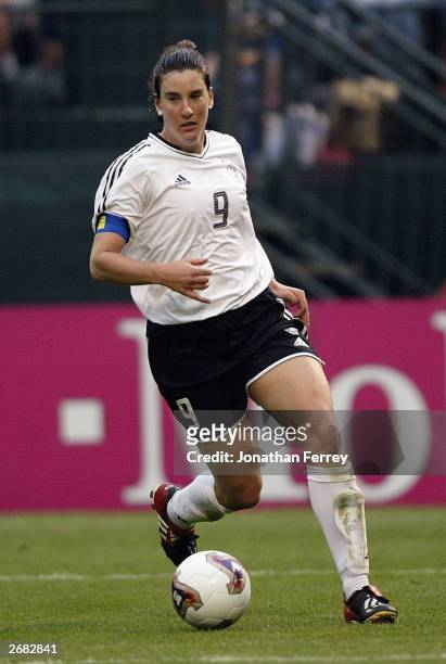 Forward Birgit Prinz of Germany dribbles the ball against Russia during the quarterfinals of the 2003 FIFA Women's World Cup at PGE Park on October...