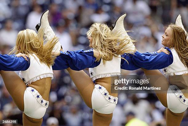 The Dallas Cowboys Cheerleaders perform during the NFL game against the Philadelphia Eagles at Texas Stadium on October 12, 2003 in Irving, Texas....