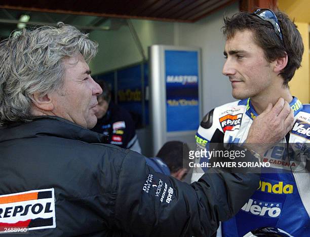 Angel Nieto , thirteen-time World Champion Congratulates his son Pablo Nieto after he obtained second place in the pole during the second 125cc...