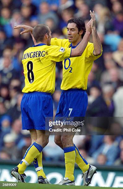 Robert Pires of Arsenal celebrates scoring with Freddie Ljungberg during the FA Barclaycard Premiership match between Leeds United and Arsenal...