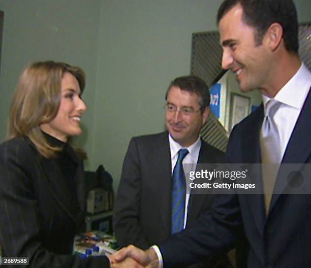 In this undated handout from Television Espanola, TV presenter Letizia Ortiz Rocasolano shakes hands with Prince Felipe of Spain at the Prince of...