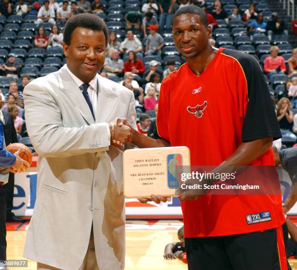 Of the Atlanta Hawks Billy Knight presents Theo Ratliff of the Hawks the 2002-2003 BLock Shot Leader Award prior the Hawks game against the Indiana...