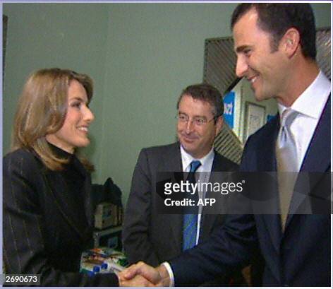 Spanish public television TVE journalist Letizia Ortiz Rocasolano shakes hands with Spanish Prince Felipe de Bourbon, the Prince of Asturias, and TVE...