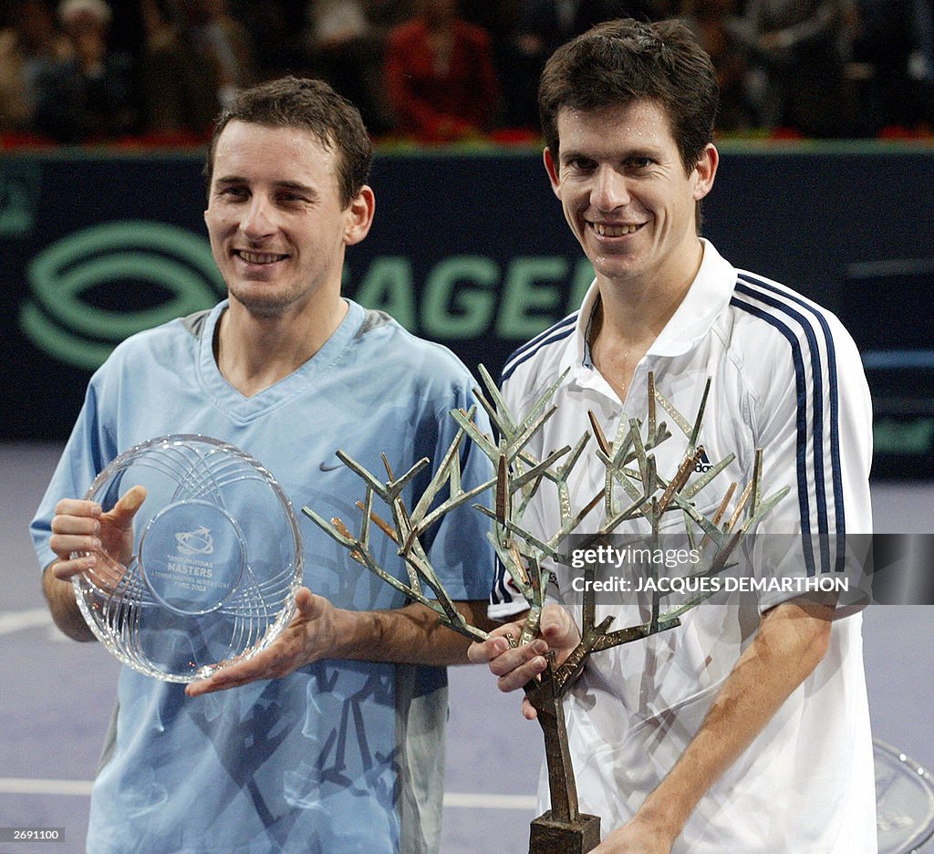 Tim Henman of Great Britain (R) and Andr