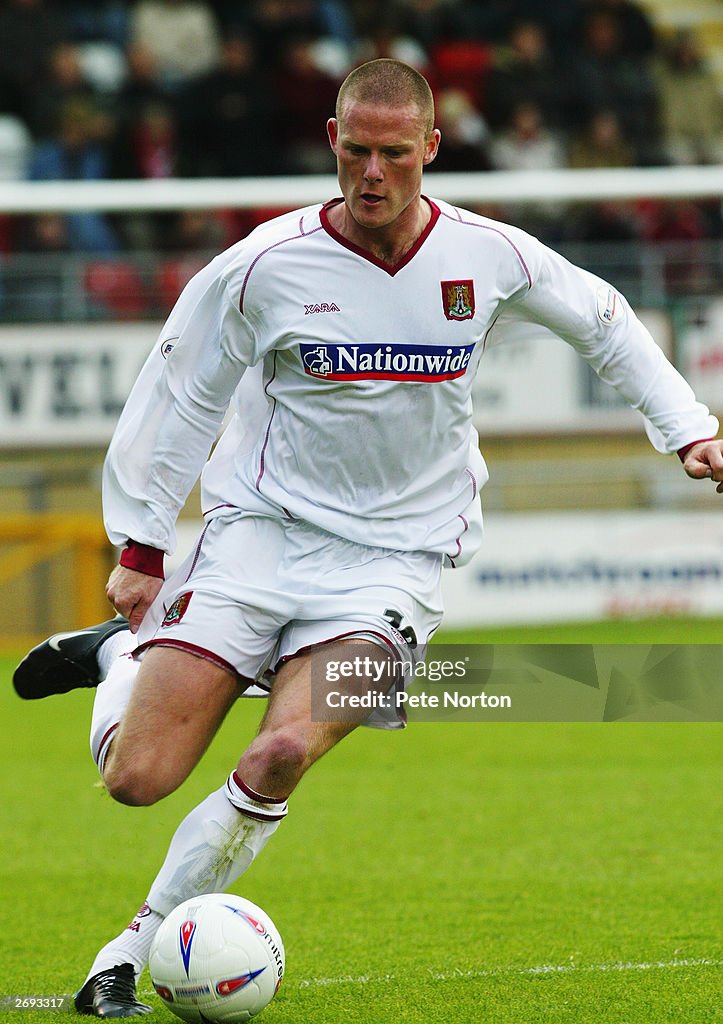 Josh Low of Northampton Town runs with the ball during the Nationwide