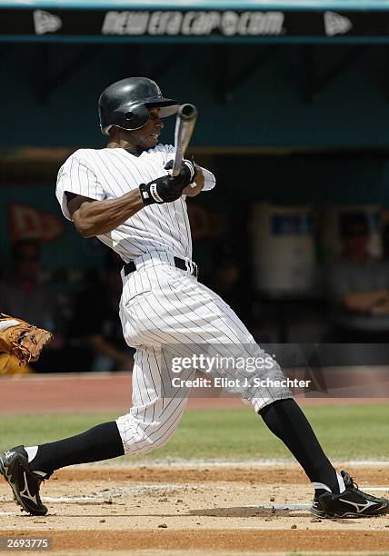 Center fielder Juan Pierre of the Florida Marlins bats against the New York Mets on September 28, 2003 at Pro Player Stadium in Miami, Florida. The...