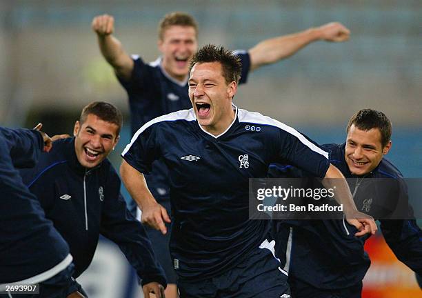 Adrian Mutu, Robert Huth and Carlo Cudicini join John Terry of Chelsea as he plays around with his team-mates during the Chelsea training session...