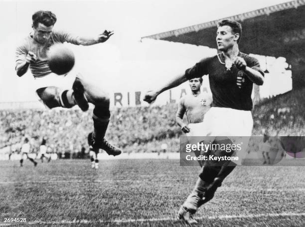 Alfredo Foni of Italy tries in vain to reach a cross during the FIFA World Cup Final against Hungary played in Paris, France. Italy won the match and...