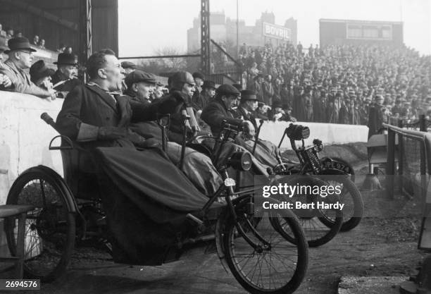 Disabled veterans of World War I watching a game between Allied servicemen and a British Army team at Stamford Bridge, Chelsea. Original Publication:...