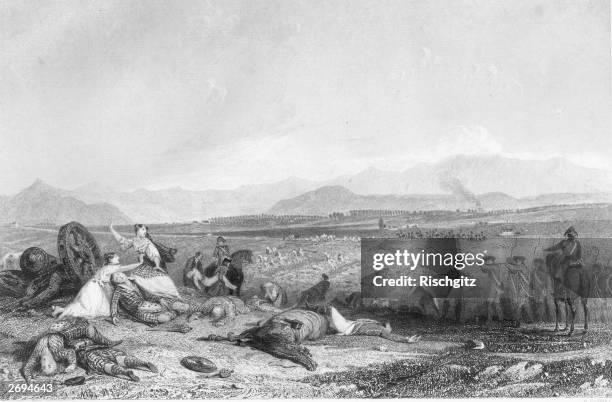 Culloden Moor in Inverness looking towards the Moray Firth with British soldiers firing on fleeing and dying soldiers who are being tended by their...