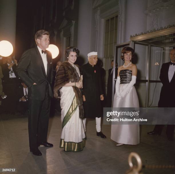 American president John F. Kennedy with his wife Jackie , Indian prime minister Jawaharlal Nehru and Nehru's daughter Indira Gandhi .