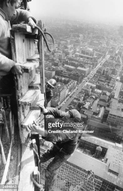 Steeplejacks constructing the GPO Tower in central London.