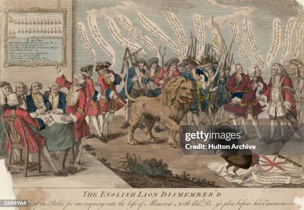 Cartoon showing a crowd of men discussing how to dissect a lion which has already lost a paw which is labelled; 'Minorca'. To the side a group of men...