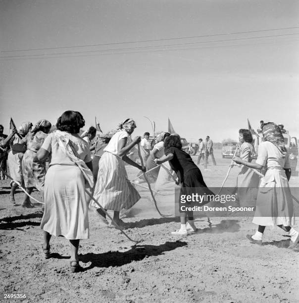 Native American women of the Popago tribal reserve in Sells, southern Arizona, playing a game of Taka.