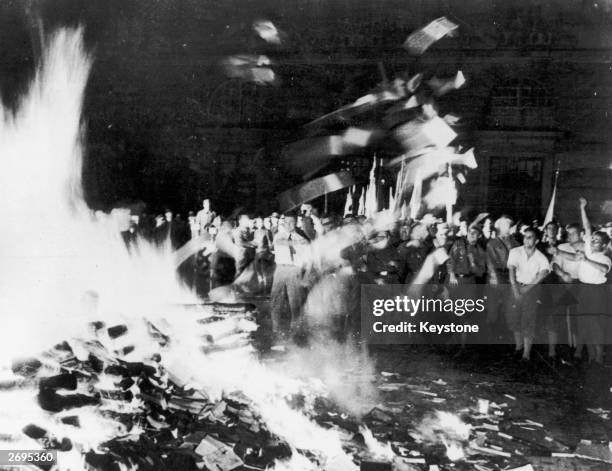 Nazis and students burn books on a huge bonfire of 'anti-German' literature in the Opernplatz, Berlin.