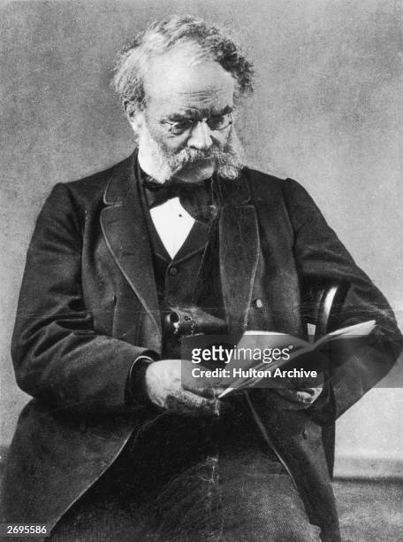 Ernst Werner von Siemens reading a book. An electrical engineer who specialised in developing telegraphic and electrical apparatus he became head of...