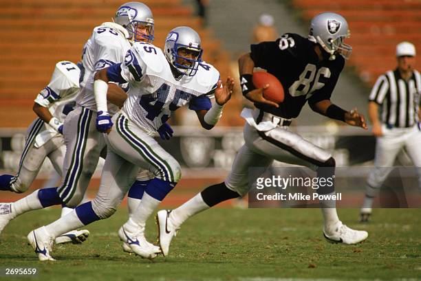 Safety Kenny Easley of the Seattle Seahawks chases wide receiver Mervyn Fernandez of the Los Angeles Raiders during the NFL game at the Los Angeles...