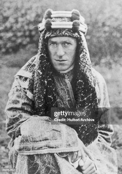 Portrait of Welsh-born archaeologist, author and military leader Thomas E. Lawrence , aka 'Lawrence of Arabia', wearing a headdress. Lawrence led the...