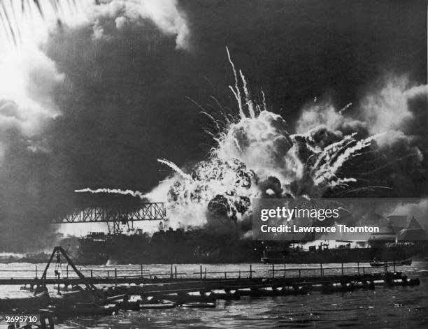 View of the USS Shaw exploding at the U.S. Naval Base, Pearl Harbor, Hawaii, after the Japanese bombing.