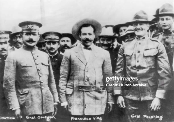 Mexican general Alvaro Obregon , Mexican revolutionary Francisco Villa , and American general John Pershing pose for a photo with other military...