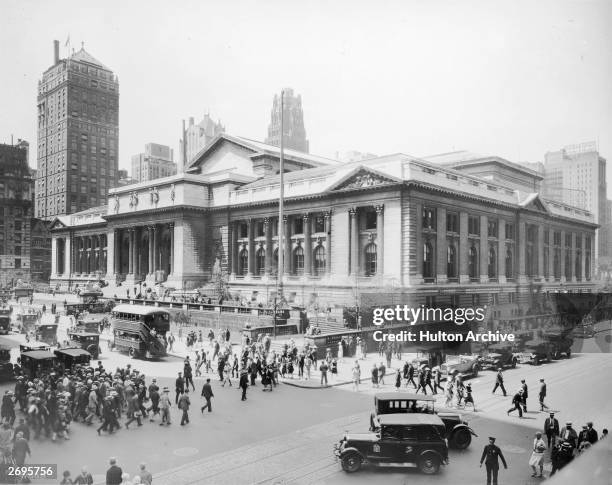 Exterior view of the main branch of the New York Public Library at the intersection of 42nd Street and Fifth Avenue in Midtown Manhattan, New York...