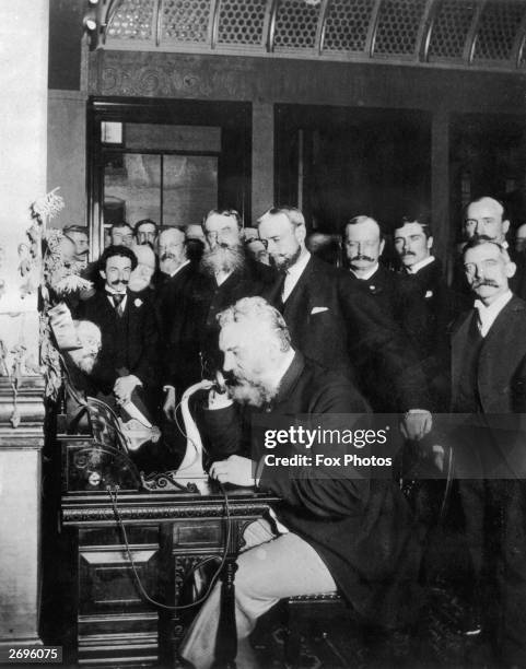 Alexander Graham Bell makes the first telephone call from New York to Chicago in 1892. Bell invented the telephone sixteen years earlier in 1876.