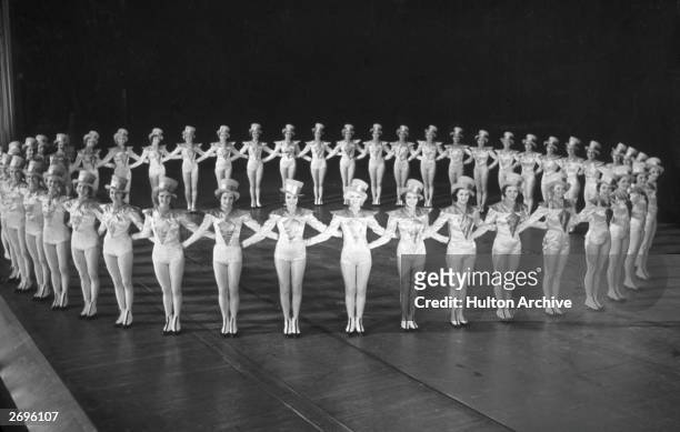 The Rockettes forming a circle on stage at Radio City Music Hall, Rockefeller Center, New York City.