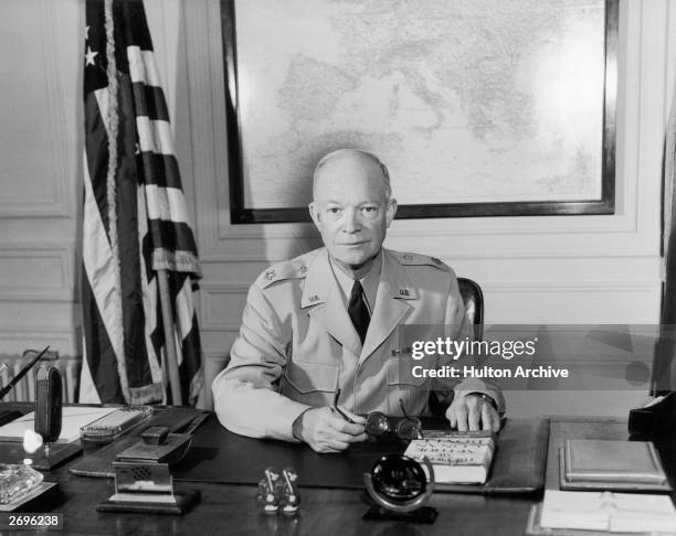 American General Dwight D Eisenhower , Supreme Allied Commander at his desk in the Marly headquarters. A Republican politician, he later became the...