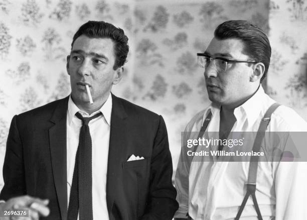 London East End gangster twins Ronnie and Reggie Kray pictured after spending 36 hours helping the police with their inquiry into the murder of...