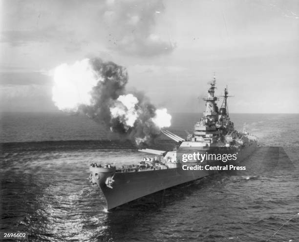 The battleship USS Missouri bombards Chongjin, North Korea, with her 16 inch guns during a mission to set out the lines of communication between the...