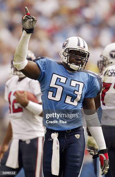 Linebacker Keith Bullock of the Tennessee Titans points up towards the sky during the game against the Houston Texans on October 12, 2003 at The...