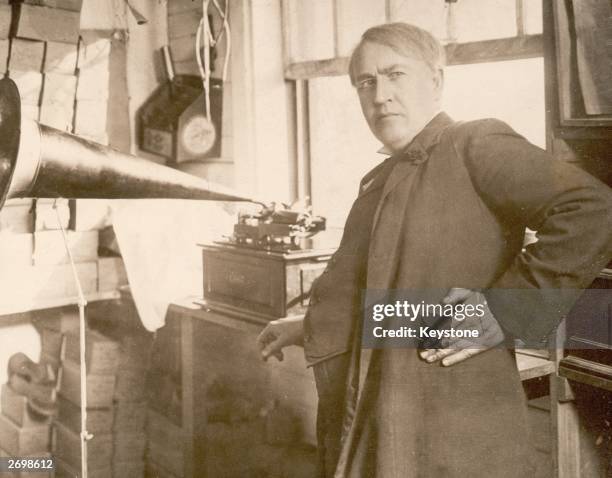 American inventor and businessman Thomas Edison with an Edison Standard Phonograph, at his lab in West Orange, New Jersey, 1906. The Edison Standard...